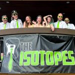 The Isotopes above a banner